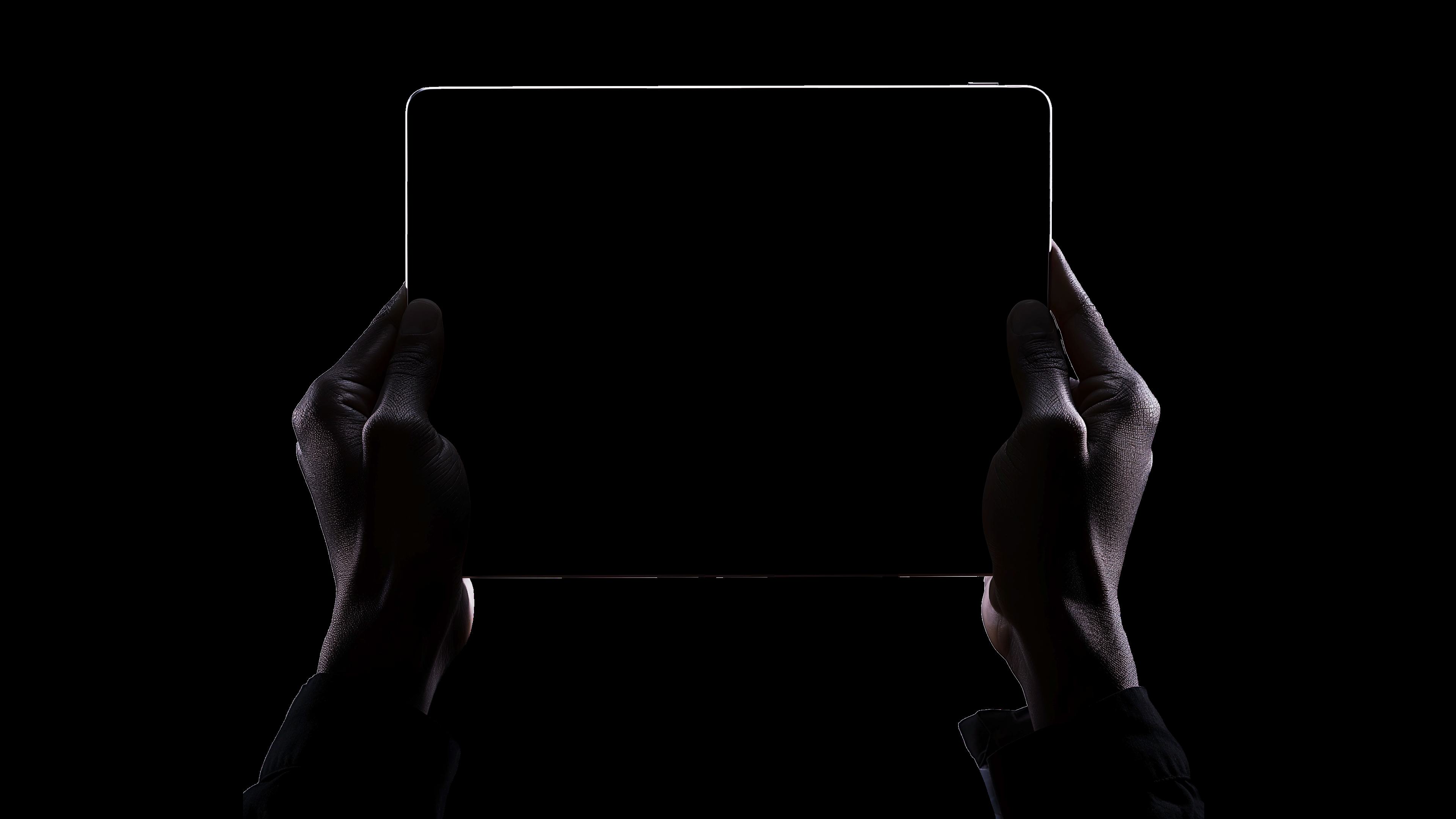 Hands holding a tablet showing DBMCI One Notes